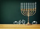 Image-Hanukkah-jewish-menorah-candles-donuts-chalkboard.jpg